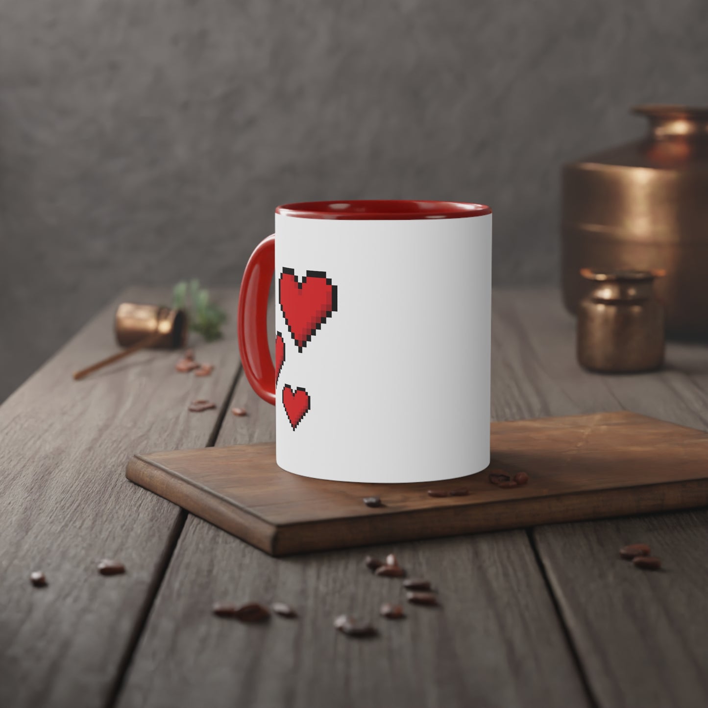 Close up image of a white ceramic magic mug with red handle, inner side and a picture of pixel heart with black edges, table view